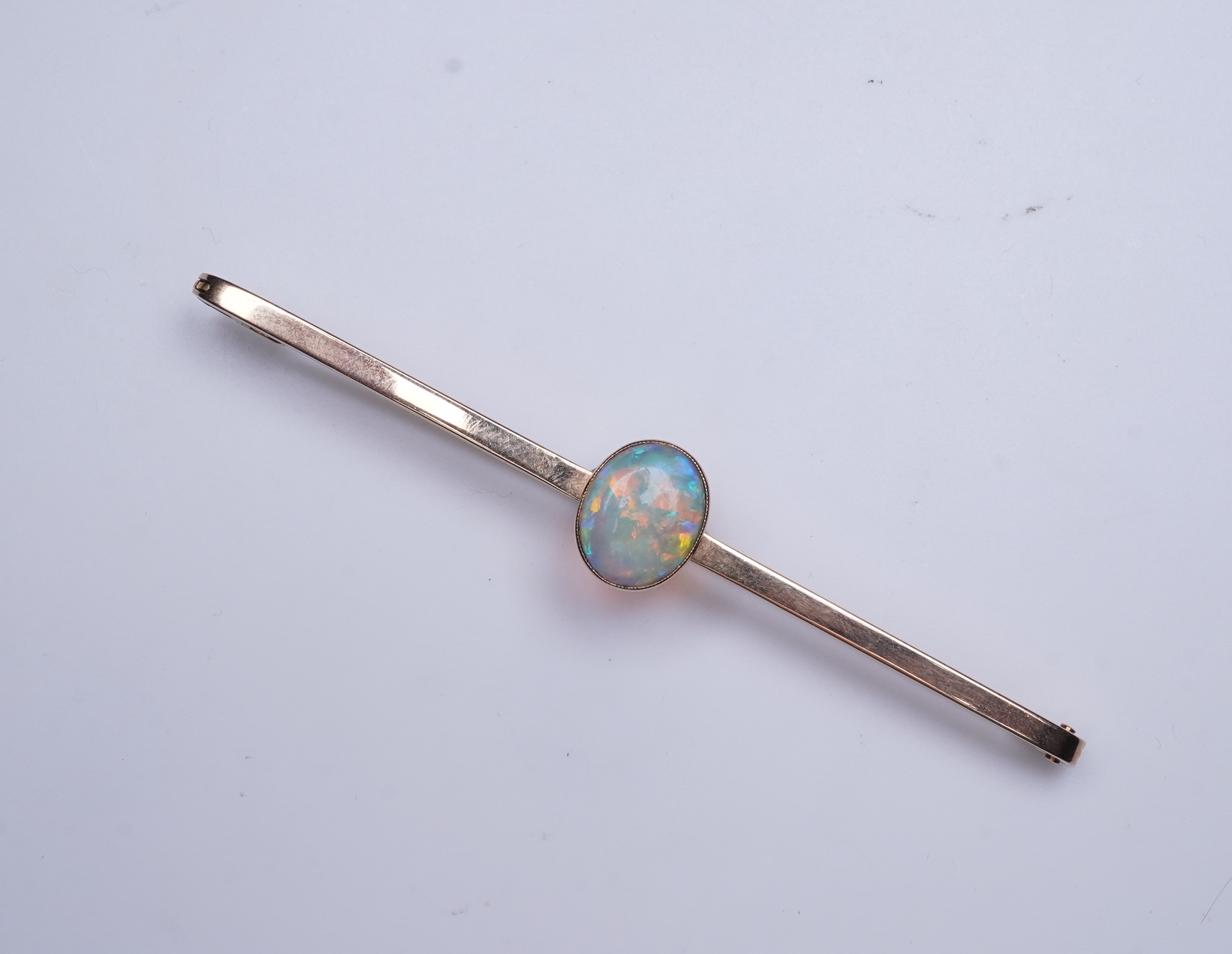 An Edwardian gold and opal brooch, early 20th century